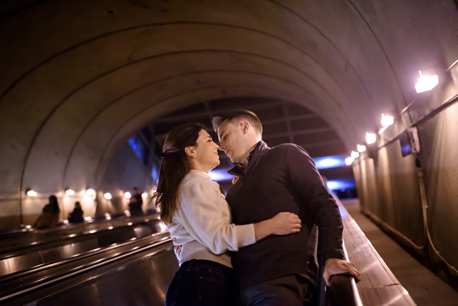 A couple kiss on the escalator on their way home from their DC engagement session.